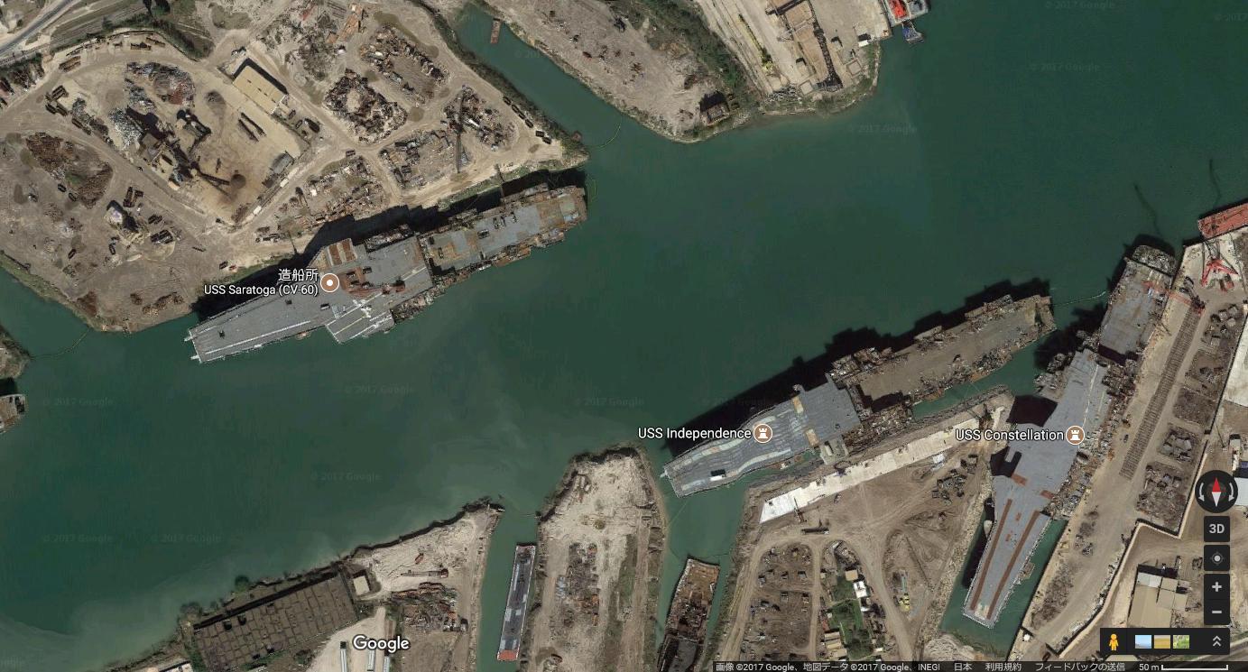 Three aircraft carriers in the process of being broken up for recycling at Brownsville...